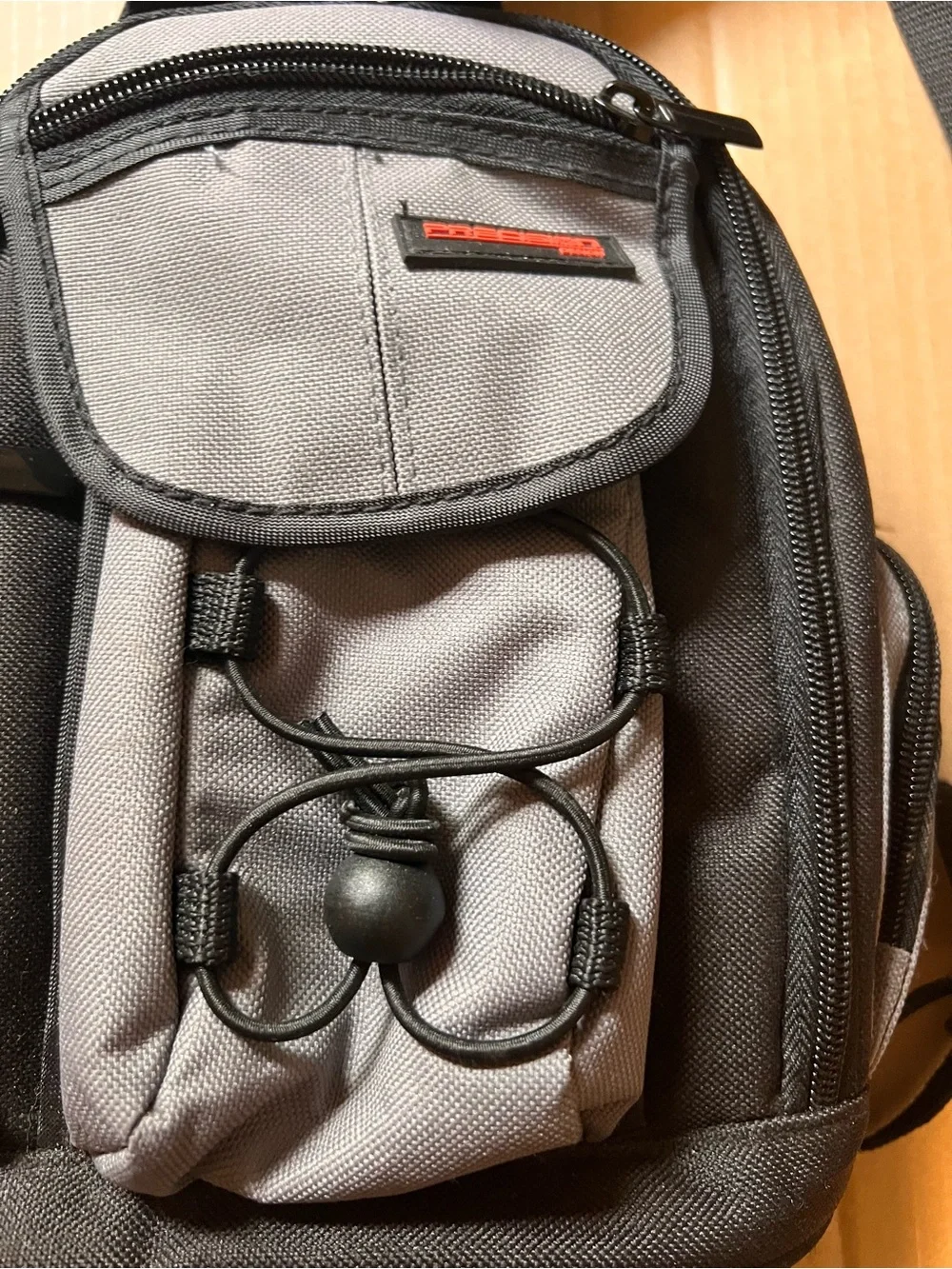 Compact Gray & Black Sling Precision Design Camera Backpack